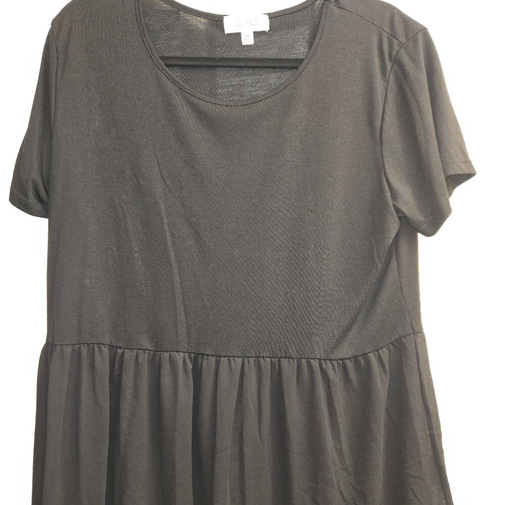 Black knit top with ruffled bottom